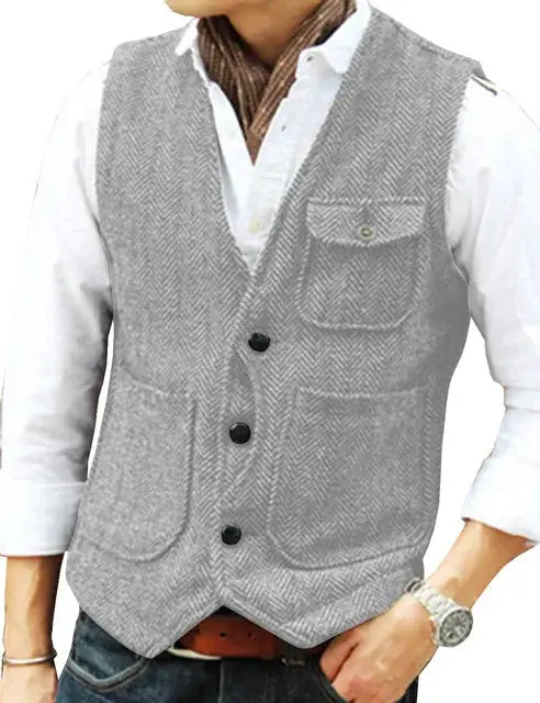 Men's grey herringbone wool tweed vest with V-neck, single-breasted front buttons, chest pocket and patch pockets