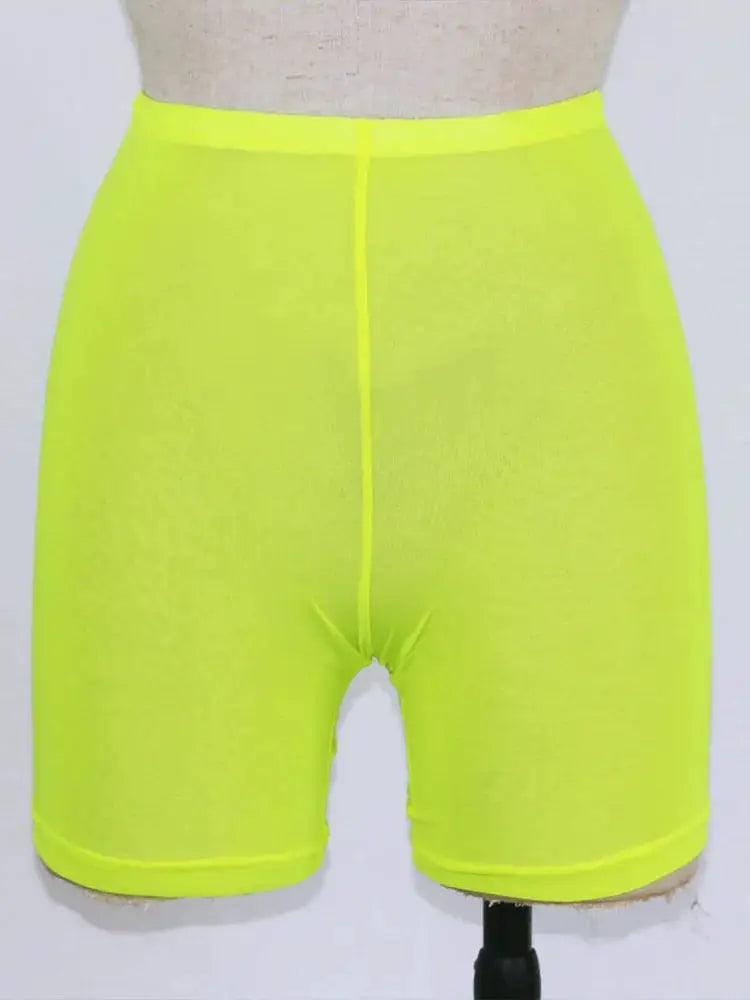 Women's neon yellow high-waist mesh shorts with a tight, short-length fit.