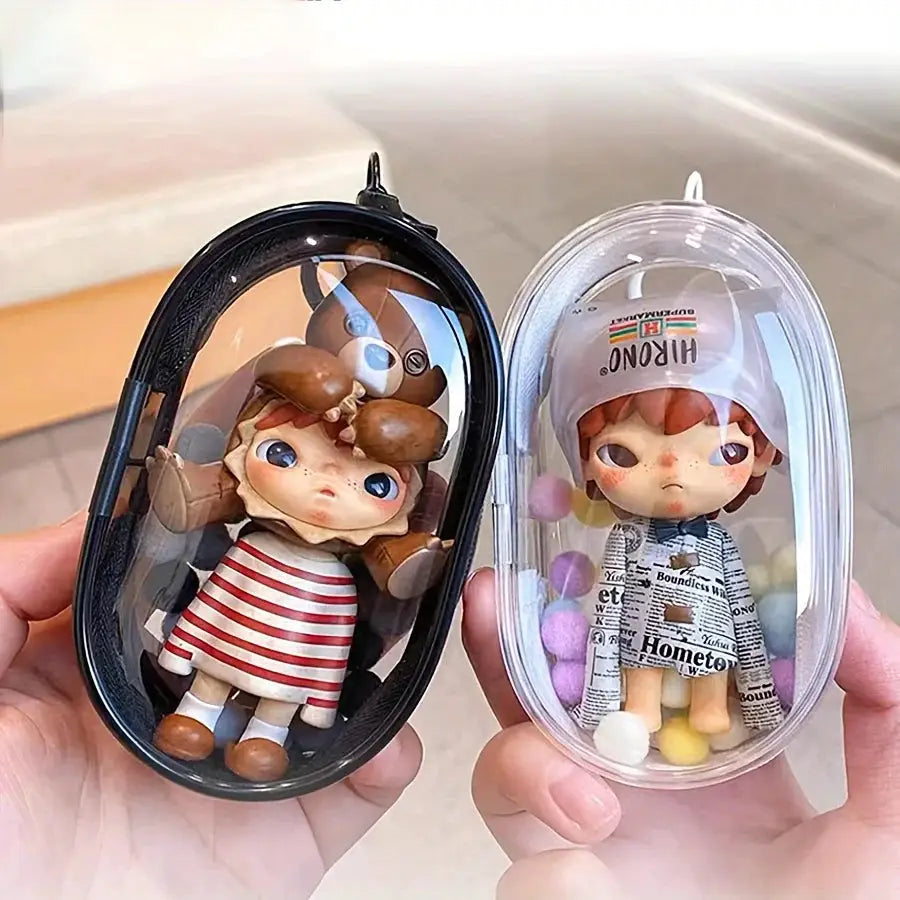 Portable mini clear zipper storage bag by Simples Market; 2 transparent cases with keychain loops holding small dolls.