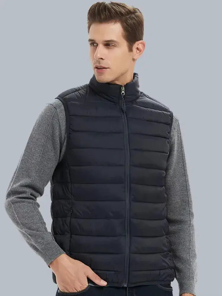 Men's cotton-padded, black quilted sleeveless puffer vest with stand collar, front zipper, and gray knit sleeves