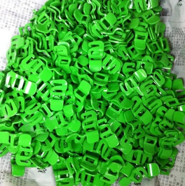 Green plastic quick-release buckles for luggage straps, many pieces
