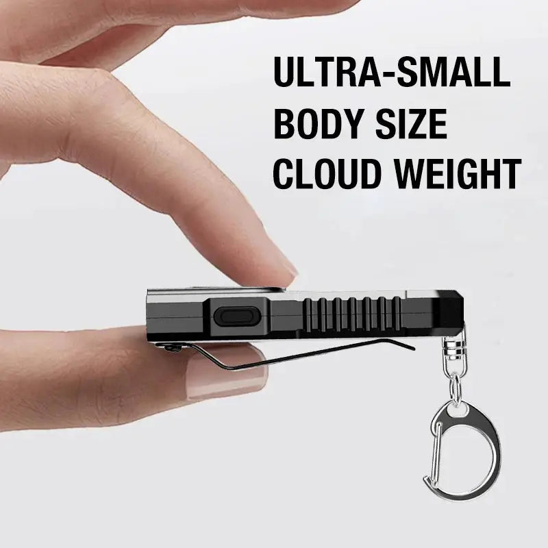 Portable waist-hanging keychain flashlight by Simples Market with emergency charging, black body