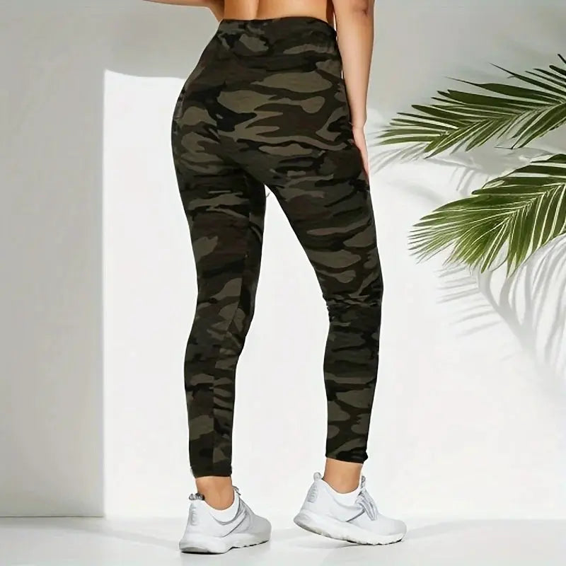 Camouflage printed women's leggings with high elasticity and slim fit in dark camo pattern.