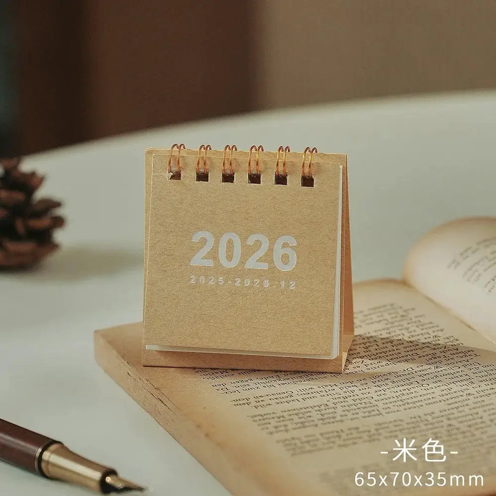 Mini 2026 desk calendar with beige kraft cover and copper coil binding, 65x70x35mm