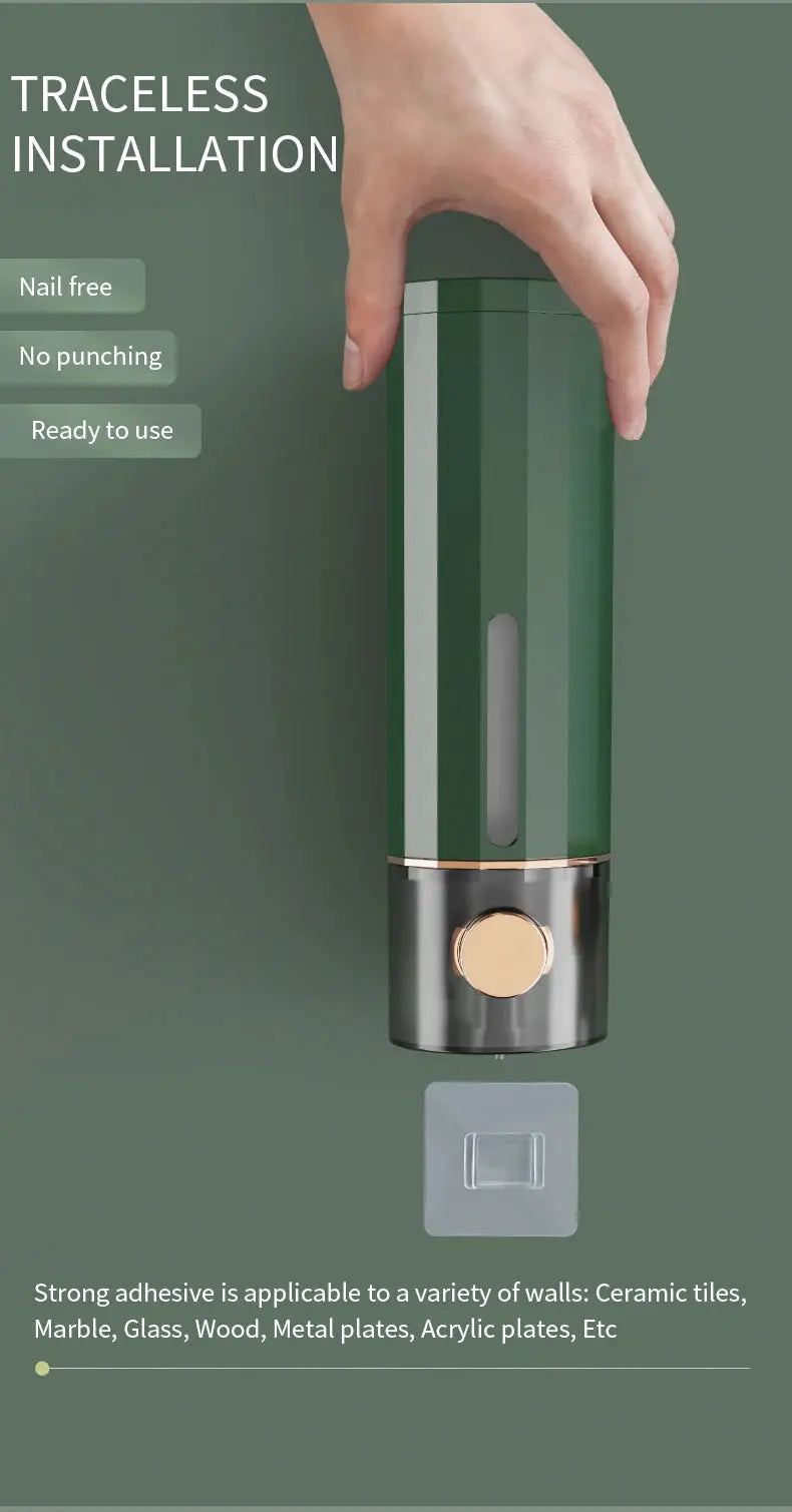 Wall-mounted manual soap dispenser in green with gold dial and vertical viewing window