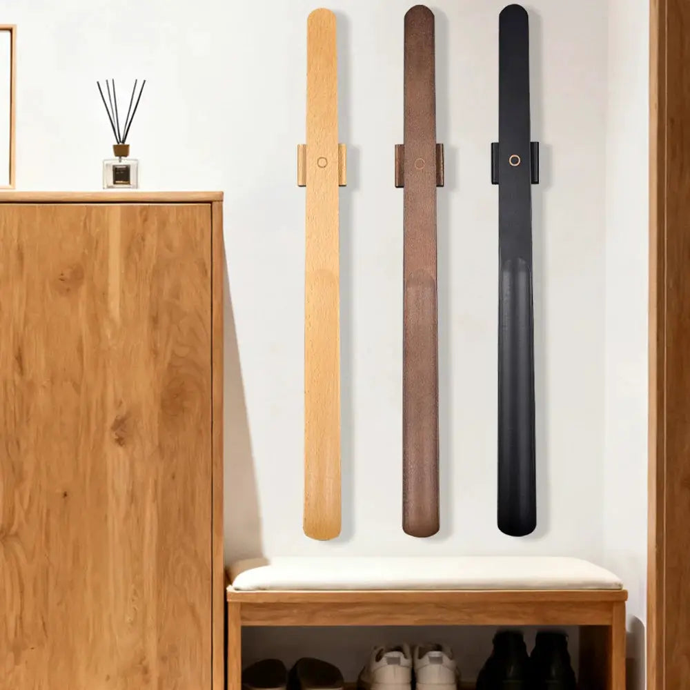 Three premium beech wood 55cm shoe horns with magnetic bases in light, brown and black finishes by Simples Market