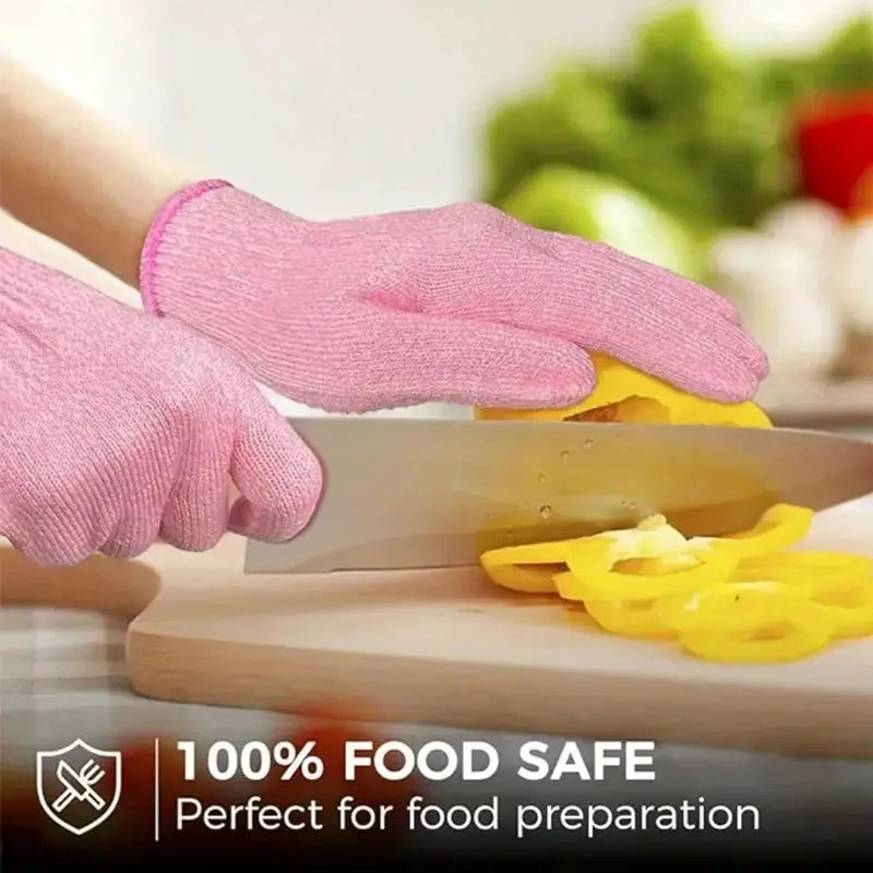 Simples Market pink anti-cutting kitchen gloves for food prep, slicing yellow peppers on a cutting board