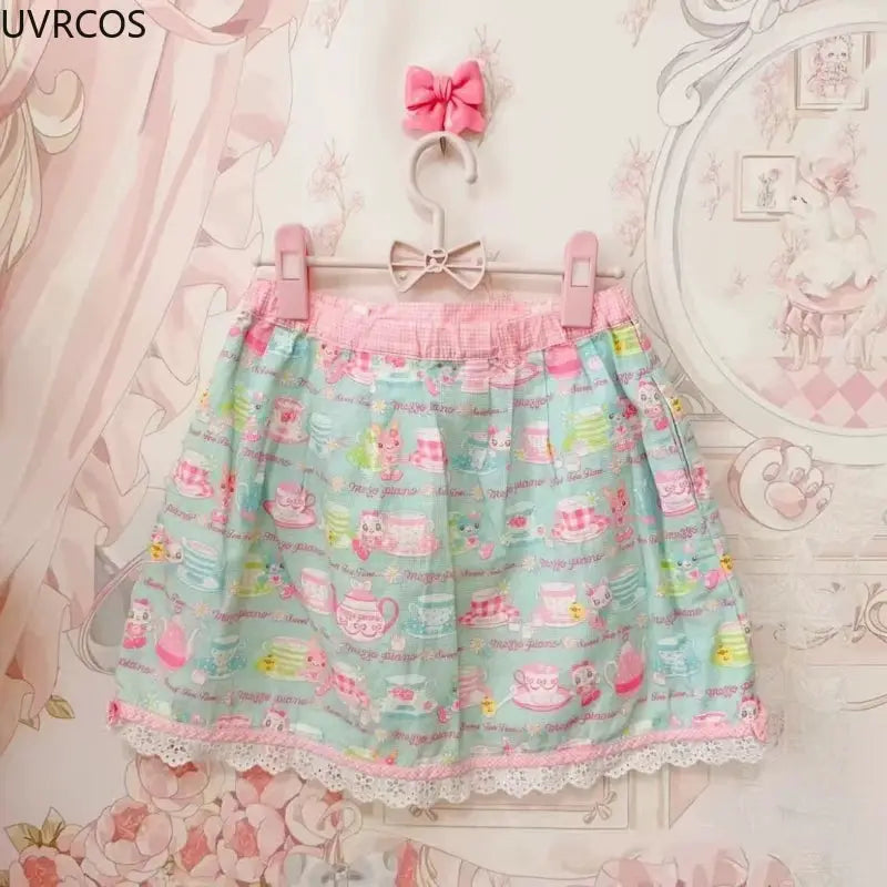 Sweet Lolita cake mini skirt for women, pastel blue with pink waistband, cartoon print and lace hem, Simples Market