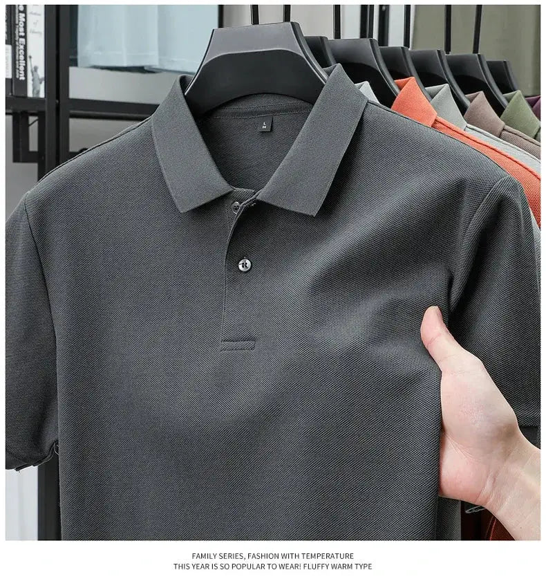 Men's polo shirt, charcoal gray, 100% cotton with a textured knit; multiple colors on display on hangers