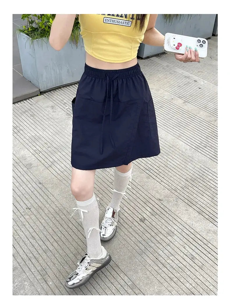 Women's navy A-line mini skirt with elastic waistband and drawstring, lightweight casual style