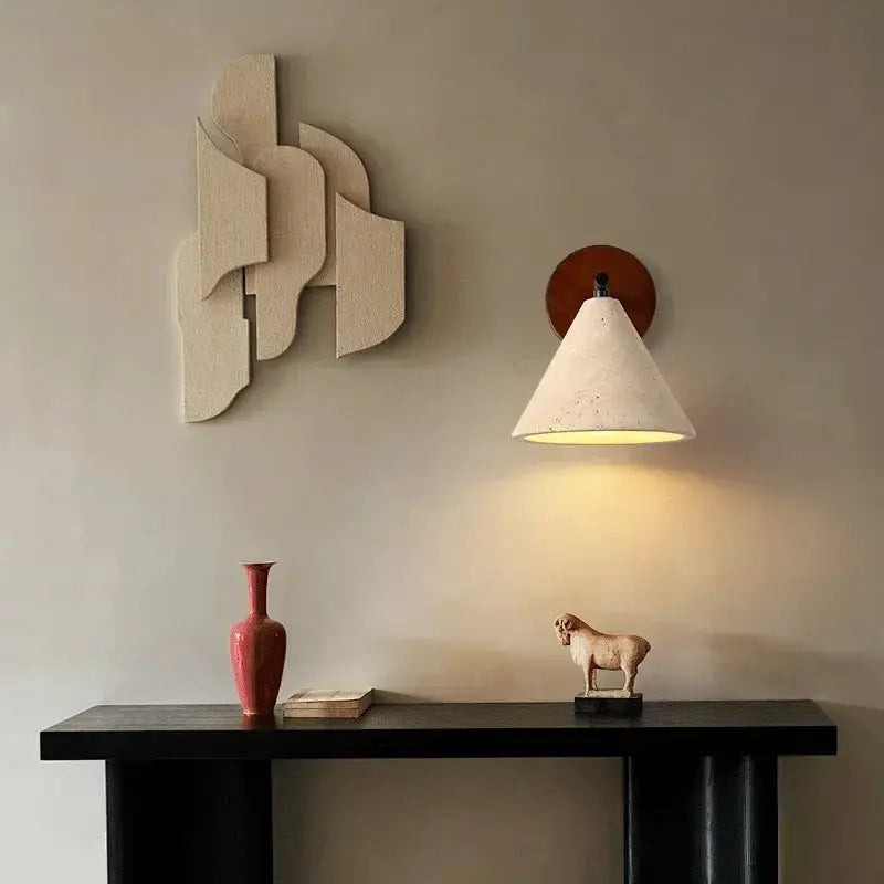 Natural stone wall lamp sconce with conical beige shade on round wood mount, warm LED lighting.