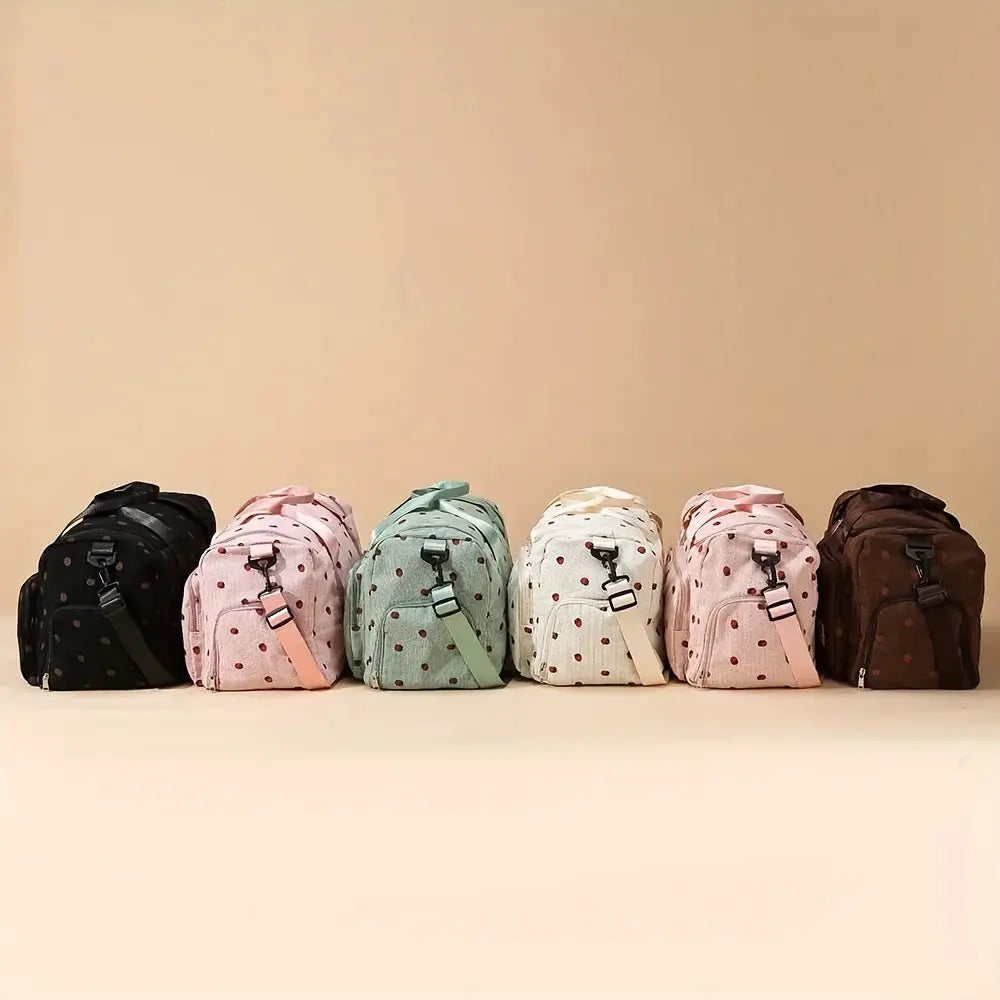 Strawberry travel bag set: six corduroy luggage bags with polka-dot pattern and crossbody straps in assorted colors
