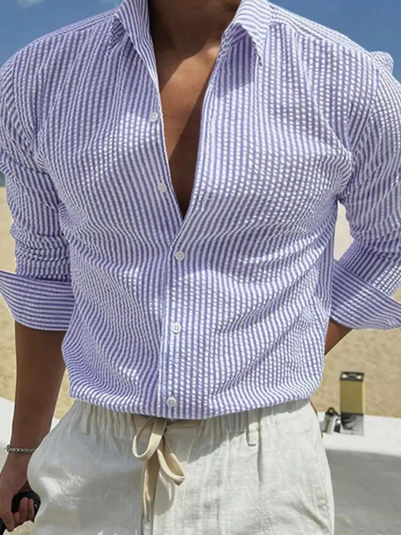 Men's blue and white striped long-sleeve shirt with a loose fit, casual outdoor wear.
