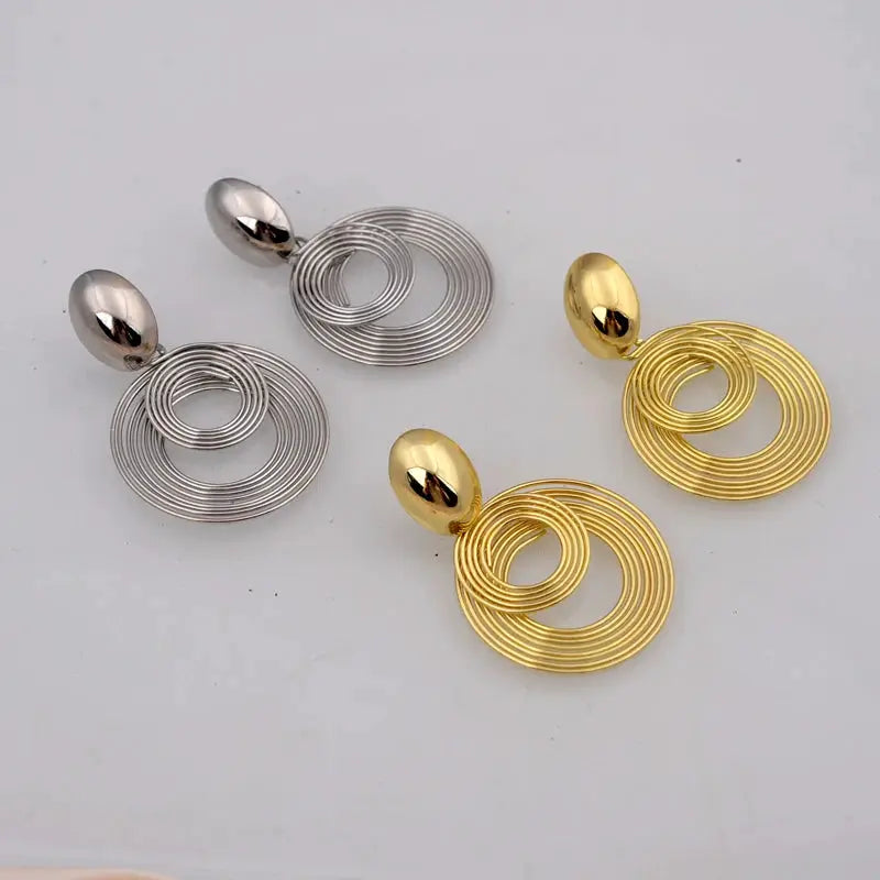 Statement earrings set of four: big round spiral geometric drops in silver and gold tones, Simples Market