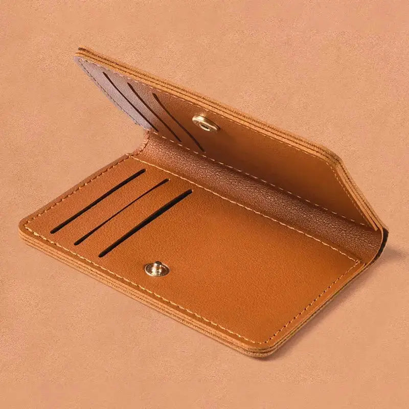 Small wallet by Simples Market tan PU leather with four card slots and snap closure