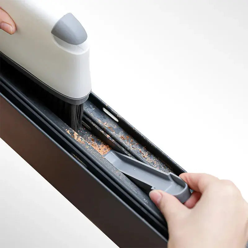 2-in-1 window rail cleaning brush with scraper in white and gray by Simples Market for window tracks and door grooves