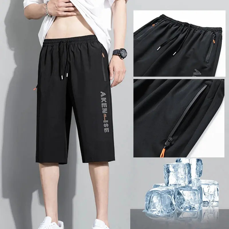 Men's black AIKEN athletic shorts with elastic waist, zip pockets, quick-dry fabric