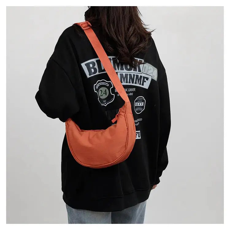 Simples Market orange nylon crescent crossbody bag with adjustable strap, large capacity