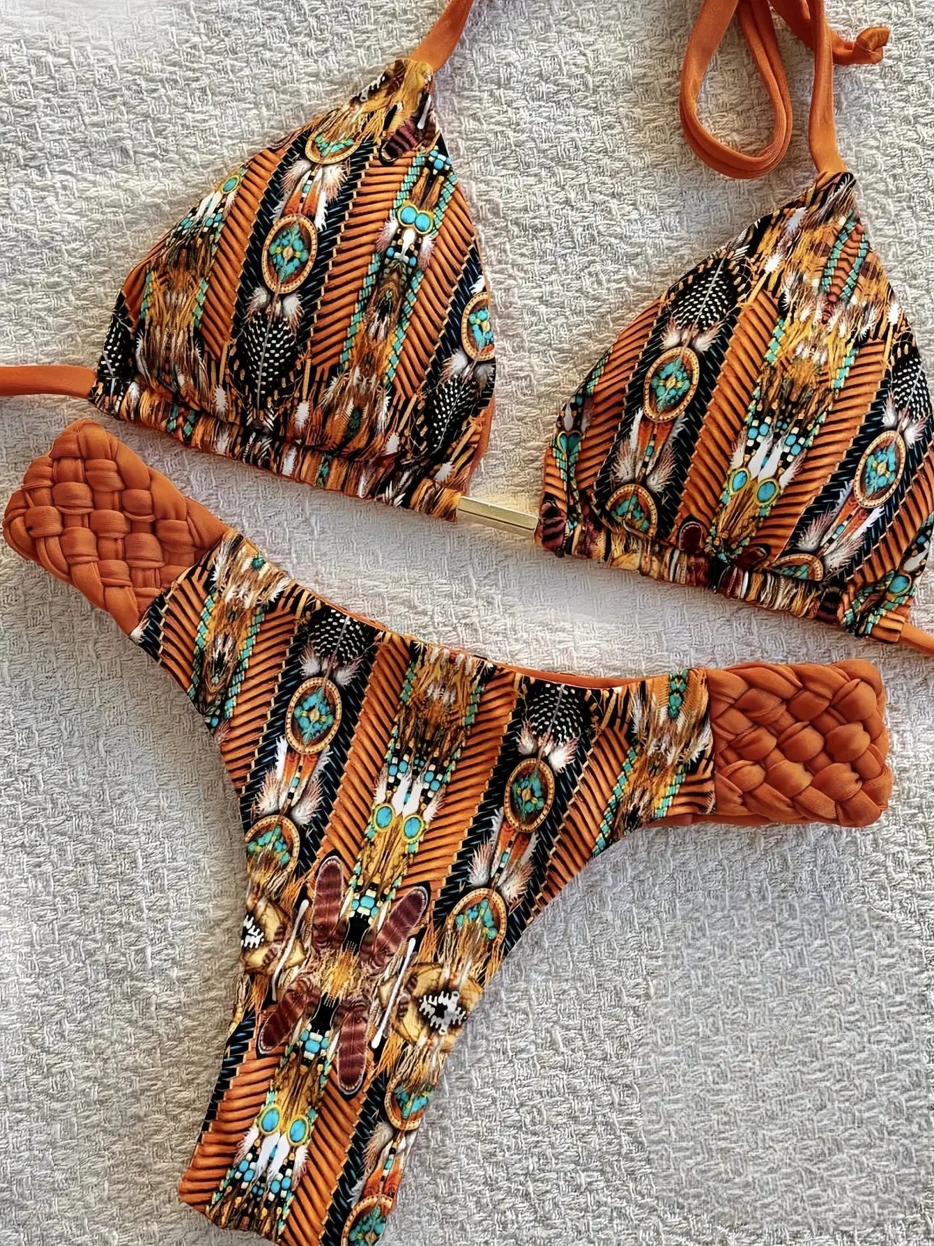 RUOTONSEPT printed halter bikini two-piece set by Simples Market; orange-brown tribal print with turquoise accents