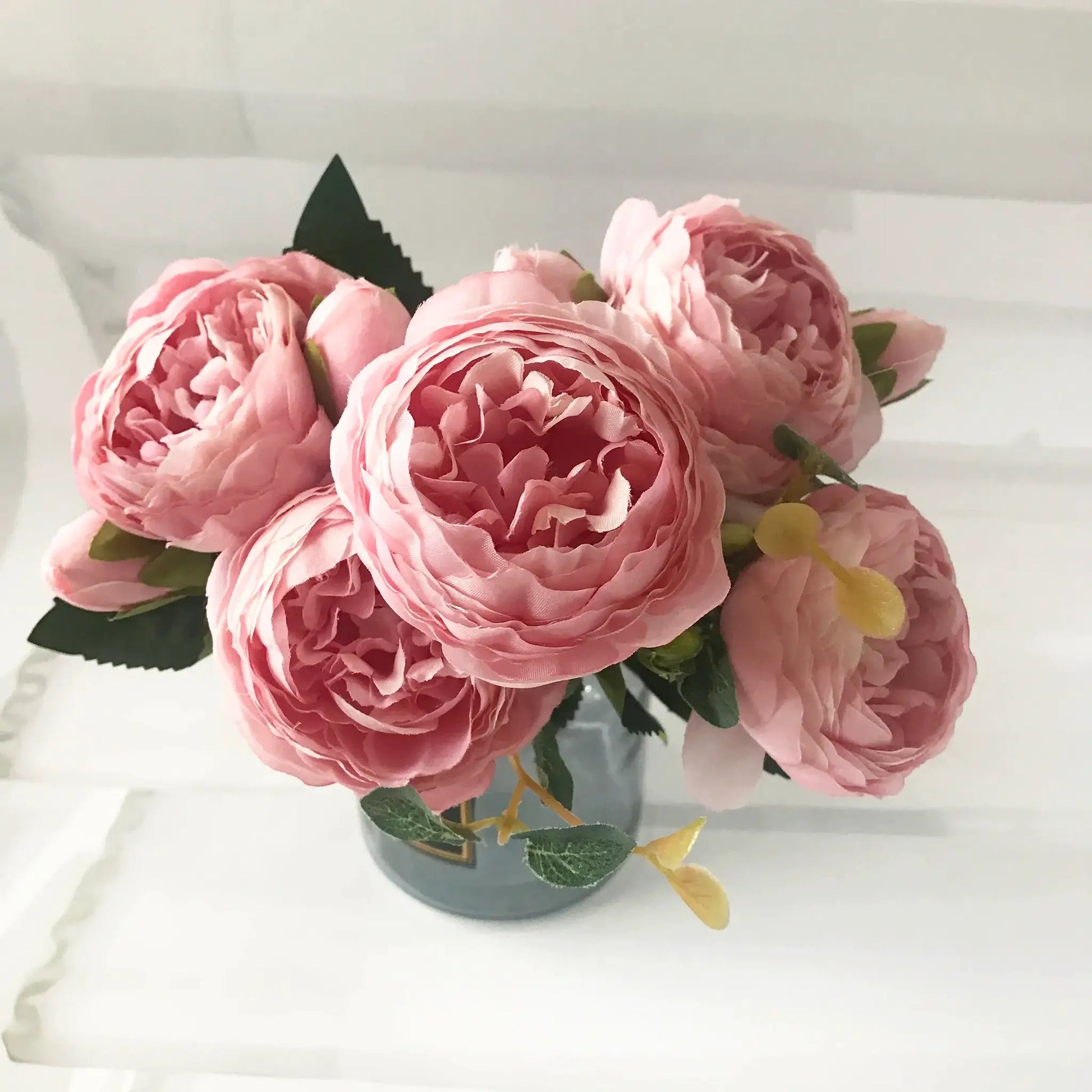 Pink silk peony artificial bouquet with large blooms and green leaves for home or wedding decor