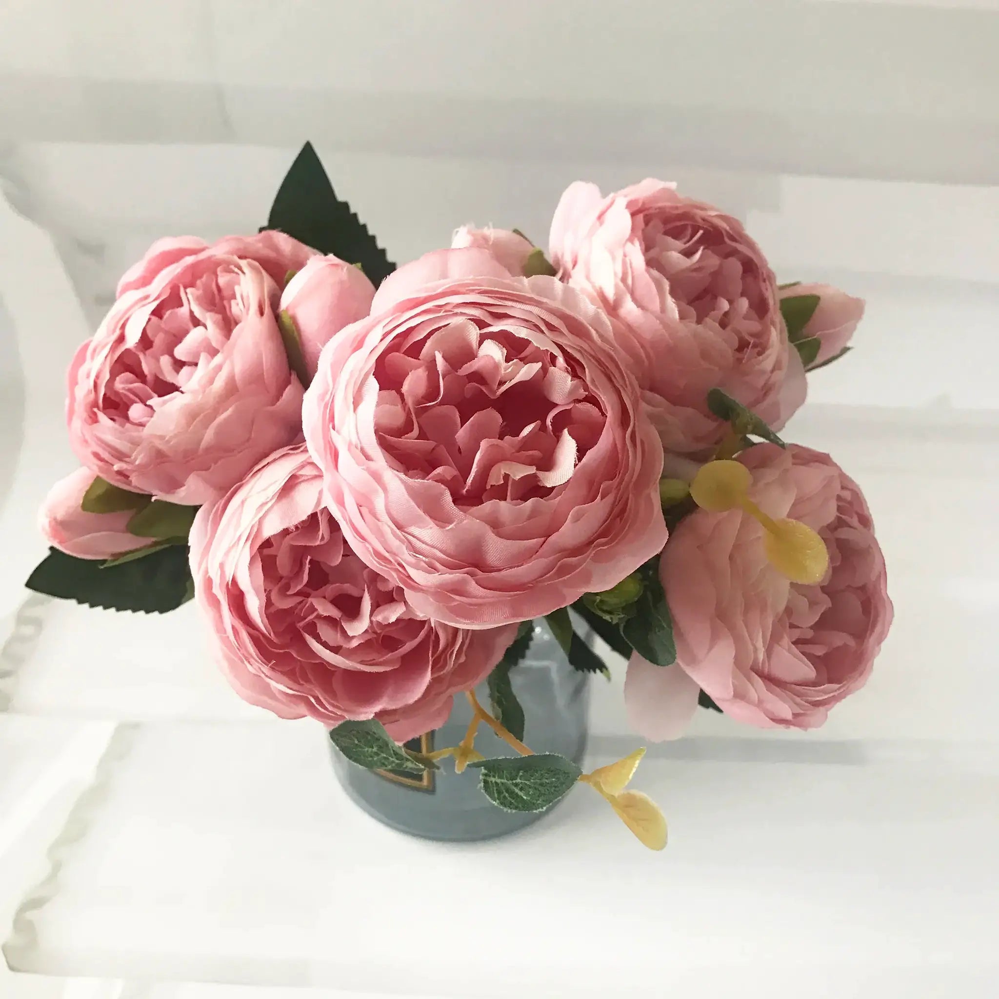 Pink silk peony artificial bouquet with large blooms and green leaves for home or wedding decor