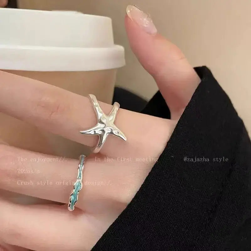 Goth Punk open-ring set, two silver-tone rings with a star-cross design and turquoise-stone band.