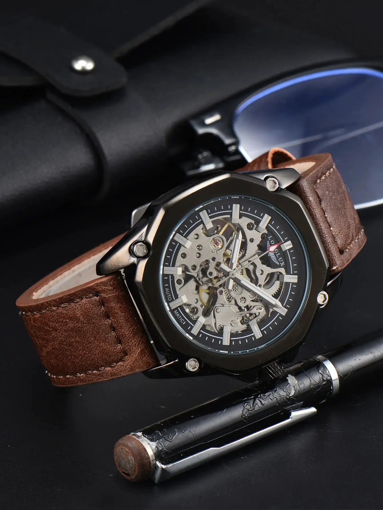 Men's skeleton automatic watch with brown leather strap and black metal case