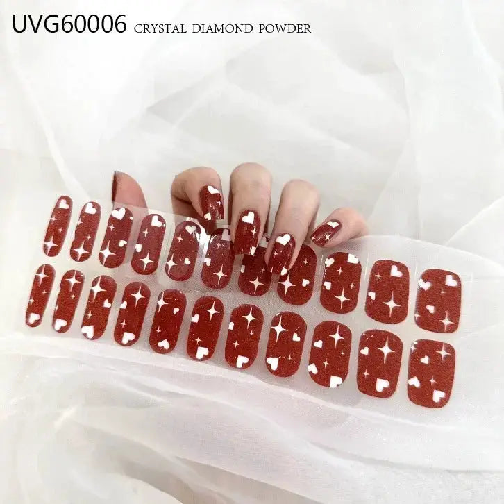 Semi-cured gel nail wrap set in burgundy with white star accents, full-cover manicure for UV lamp curing