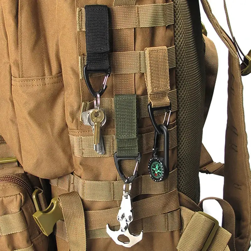 Tan nylon tactical backpack with MOLLE straps and carabiners