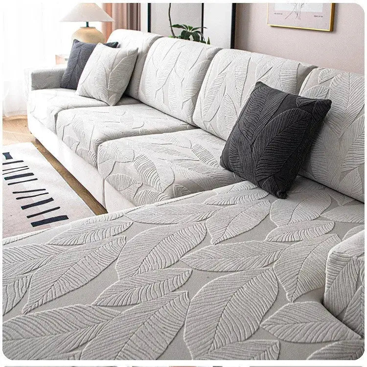 Sofa seat cushion cover in waterproof light gray jacquard leaf pattern with elastic fit for living room couches.