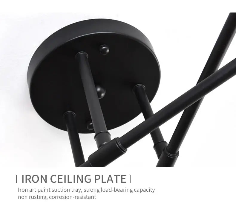 Black wrought-iron six-arm industrial ceiling lamp with round mounting plate