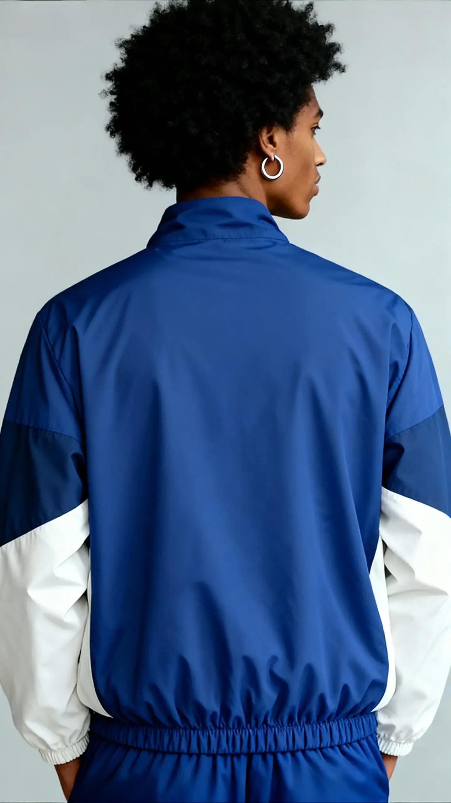 Men's color-blocked lightweight windproof jacket in blue with white sleeves by Simples Market.