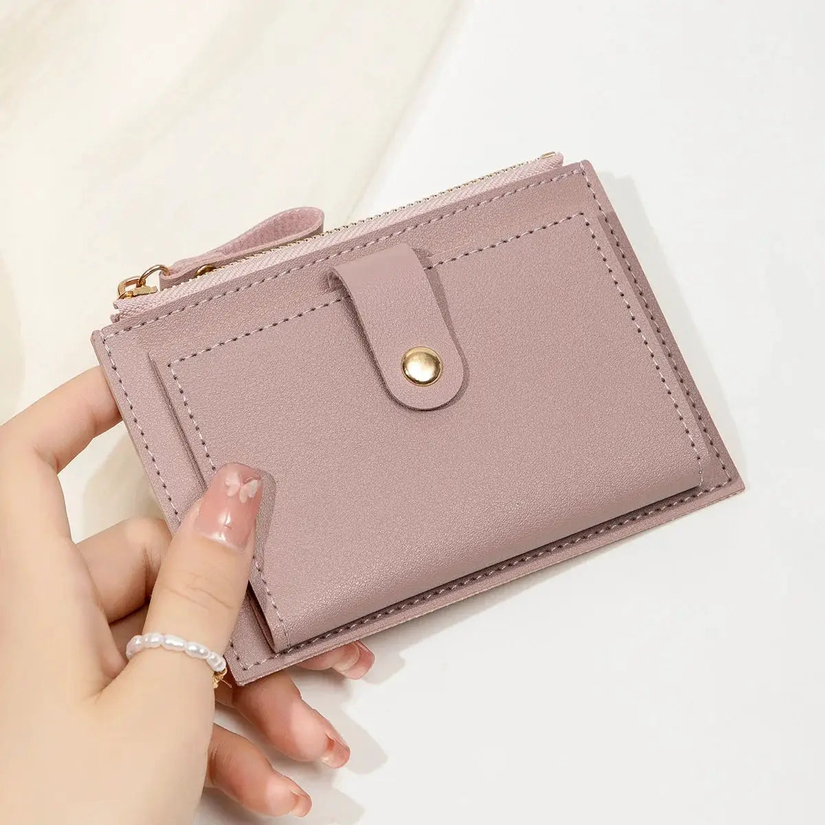 Minimalist ultra-thin pink PU leather card wallet by Simples Market with gold snap closure