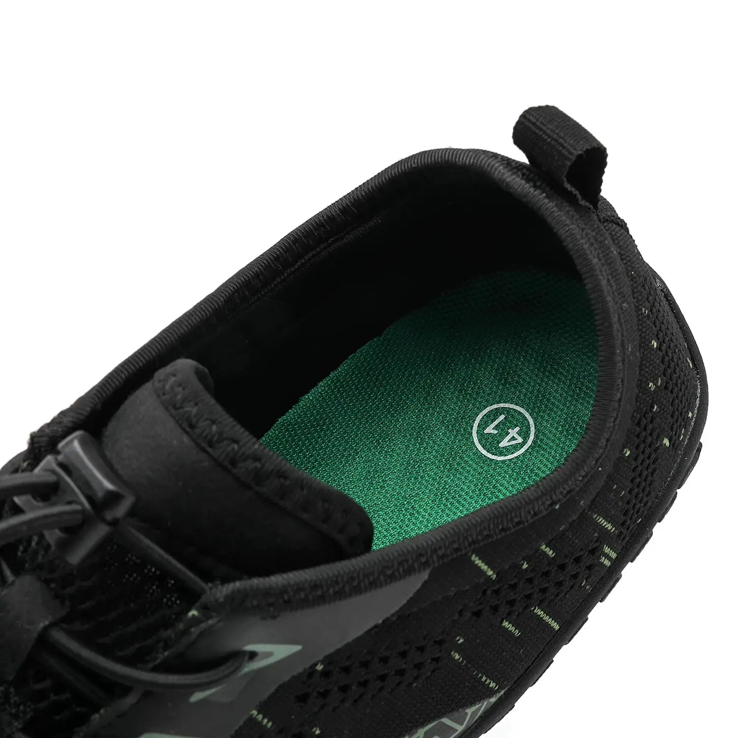 Black trail running shoe with green insole and knit mesh upper