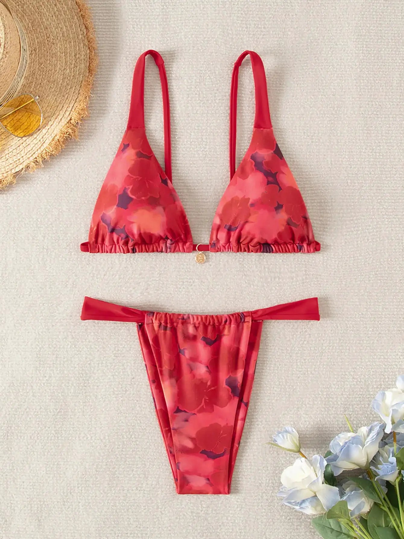 Triangle bikini set in red floral print with push-up top and Brazilian-cut bottoms