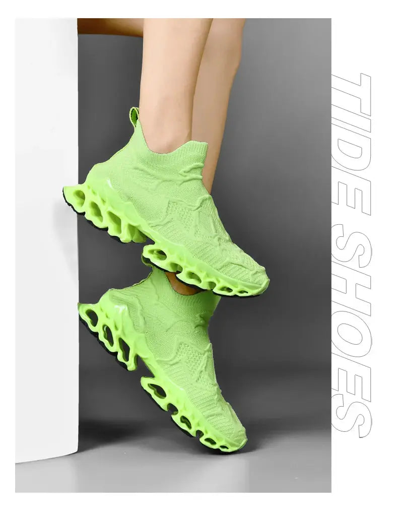 Pair of neon lime green knit running sneakers with hollow pod sole, breathable casual trainer