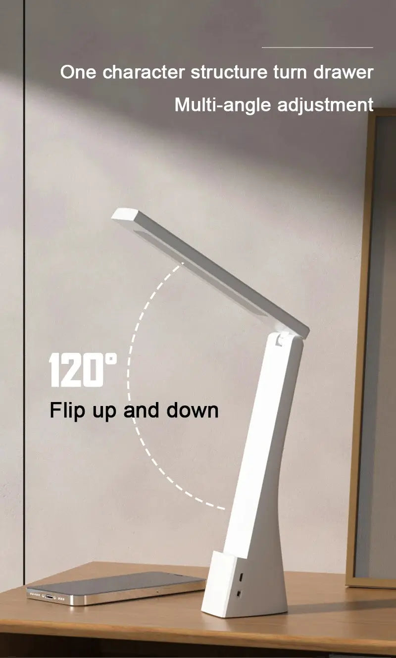 White LED desk lamp with foldable, 120° adjustable arm on a wooden desk
