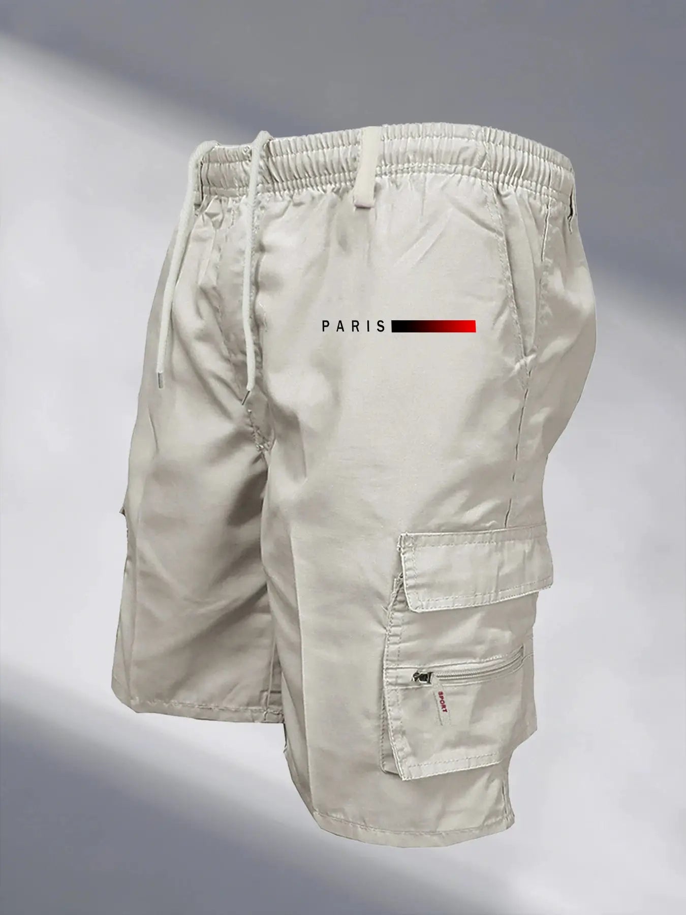 Men's tactical cargo shorts with elastic waistband, drawstring, and multiple pockets in khaki.