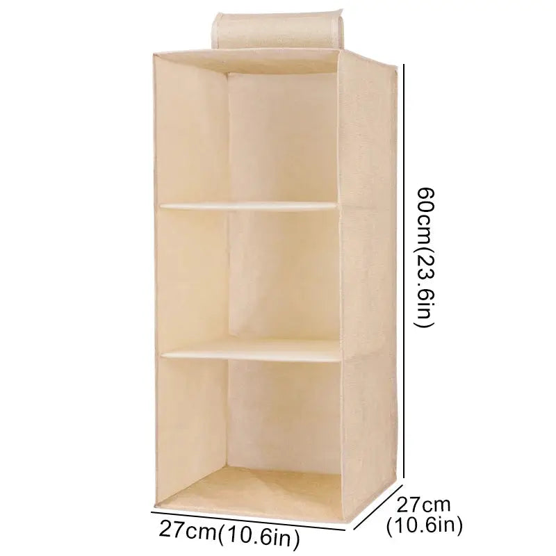 Beige cotton-linen hanging storage shelf with three compartments; collapsible wardrobe organizer, 60 cm tall
