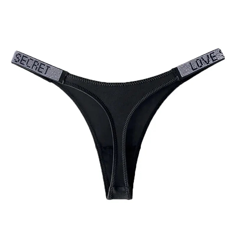 Black thong with rhinestone-embellished side straps featuring lettered words.