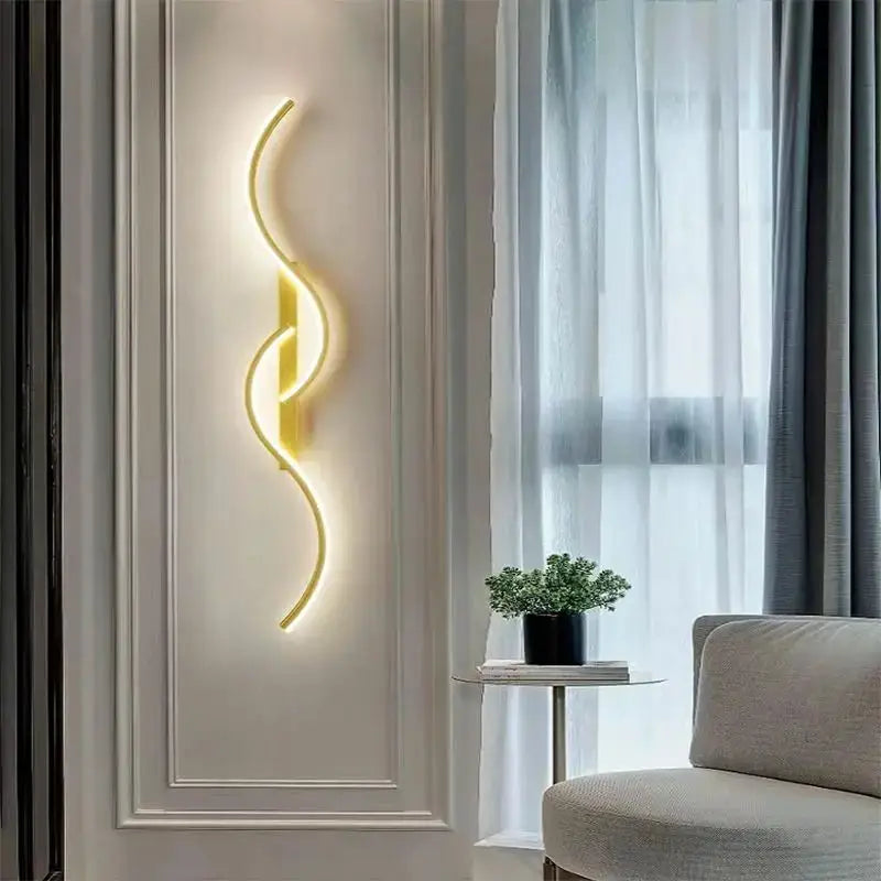 Modern LED wall lamp; minimalist curved strip light with warm yellow glow