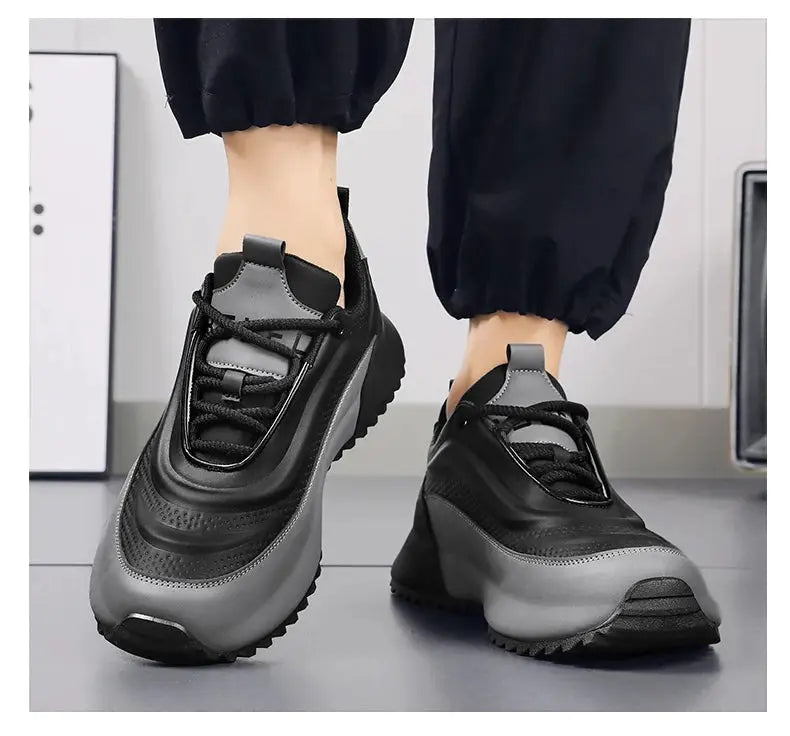Pair of men's lightweight non-slip running shoes in black and gray with a chunky sole