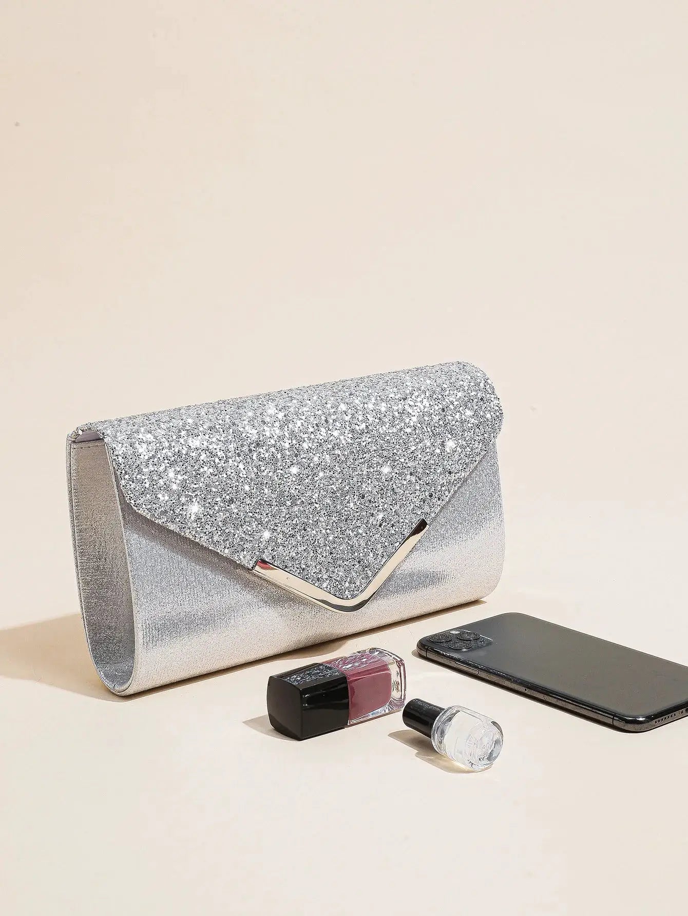 Sequin envelope clutch bag in silver for evening events with a metallic clasp