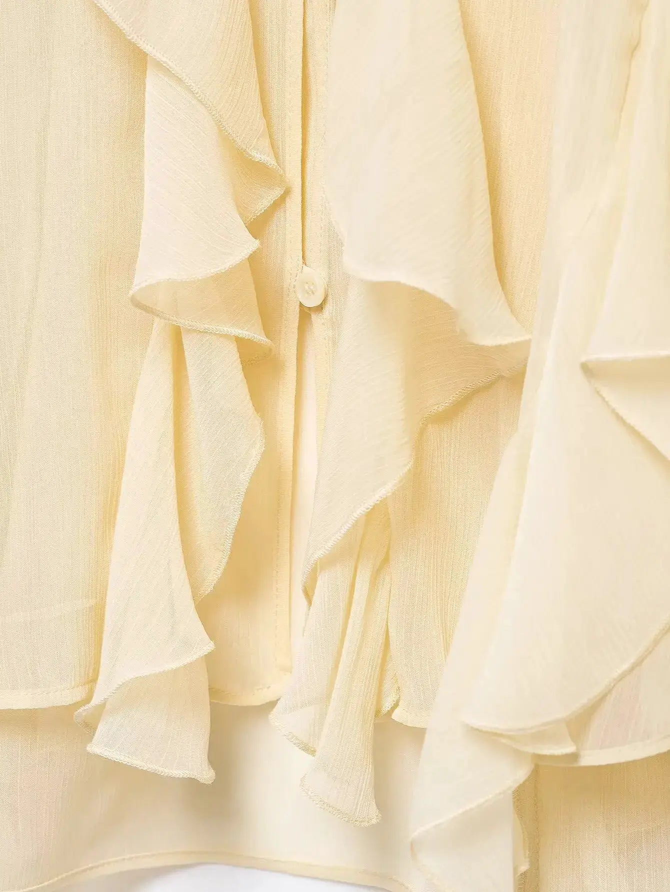Women's cream ruffled shirt with cascading frills and button placket by Simples Market