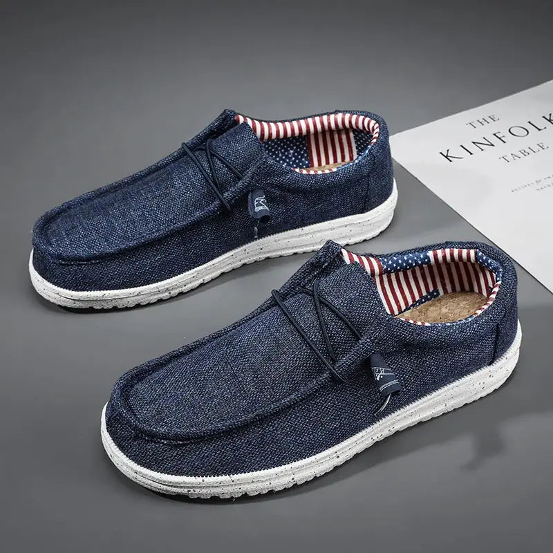 Men's casual canvas loafers in navy denim with white sole, striped inner lining, Simples Market pair