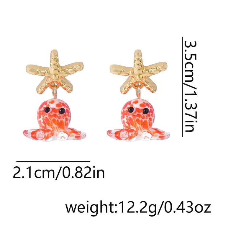 Pair of cute octopus earrings with gold star toppers and orange-pink octopus charms, 3.5 cm tall