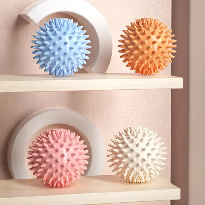 Simples Market massage balls, set of 4 spiky fascia balls in blue, orange, pink and cream.