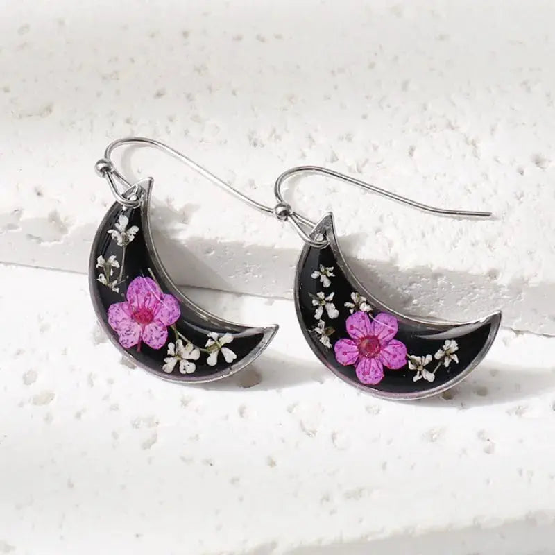 Unique Design Pressed Flower Earrings by Simples Market; crescent black epoxy with pink blossoms, silver hooks