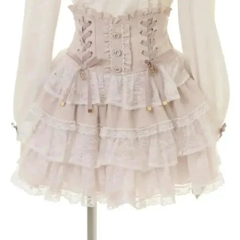 Lolita lace blouse with corset waist and tiered lace skirt in pale pink by Simples Market