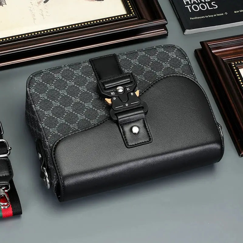 Men's crossbody bag by Simples Market with black leather bottom and grey jacquard top, front buckle strap